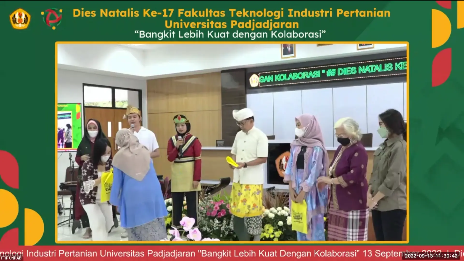 Award and appreciation session during the FTIP Unpad 2022 Dies Natalis event, where selected participants receive prizes on stage.